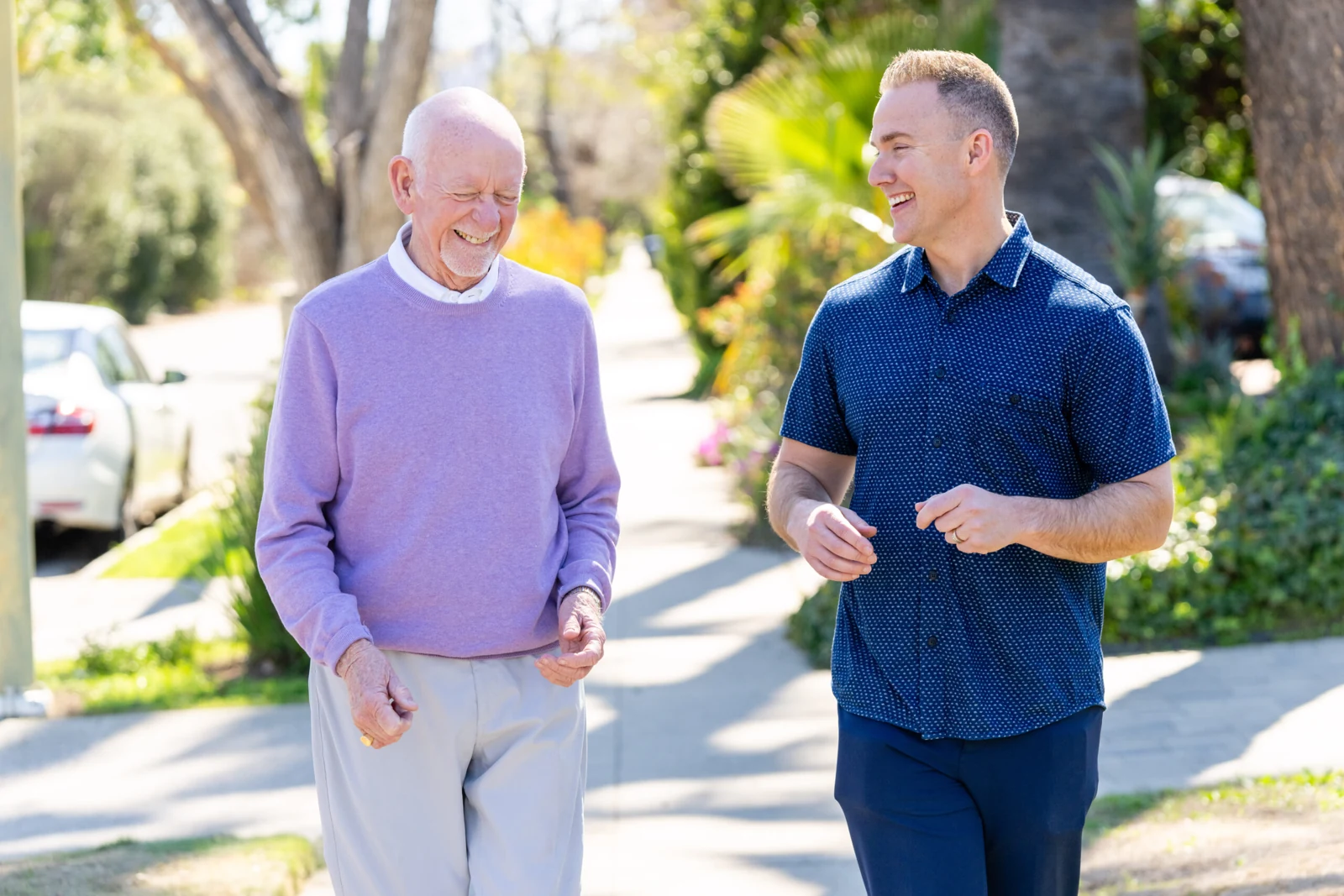 Tim sharing a laugh with a neighbor on a neighborhood walk